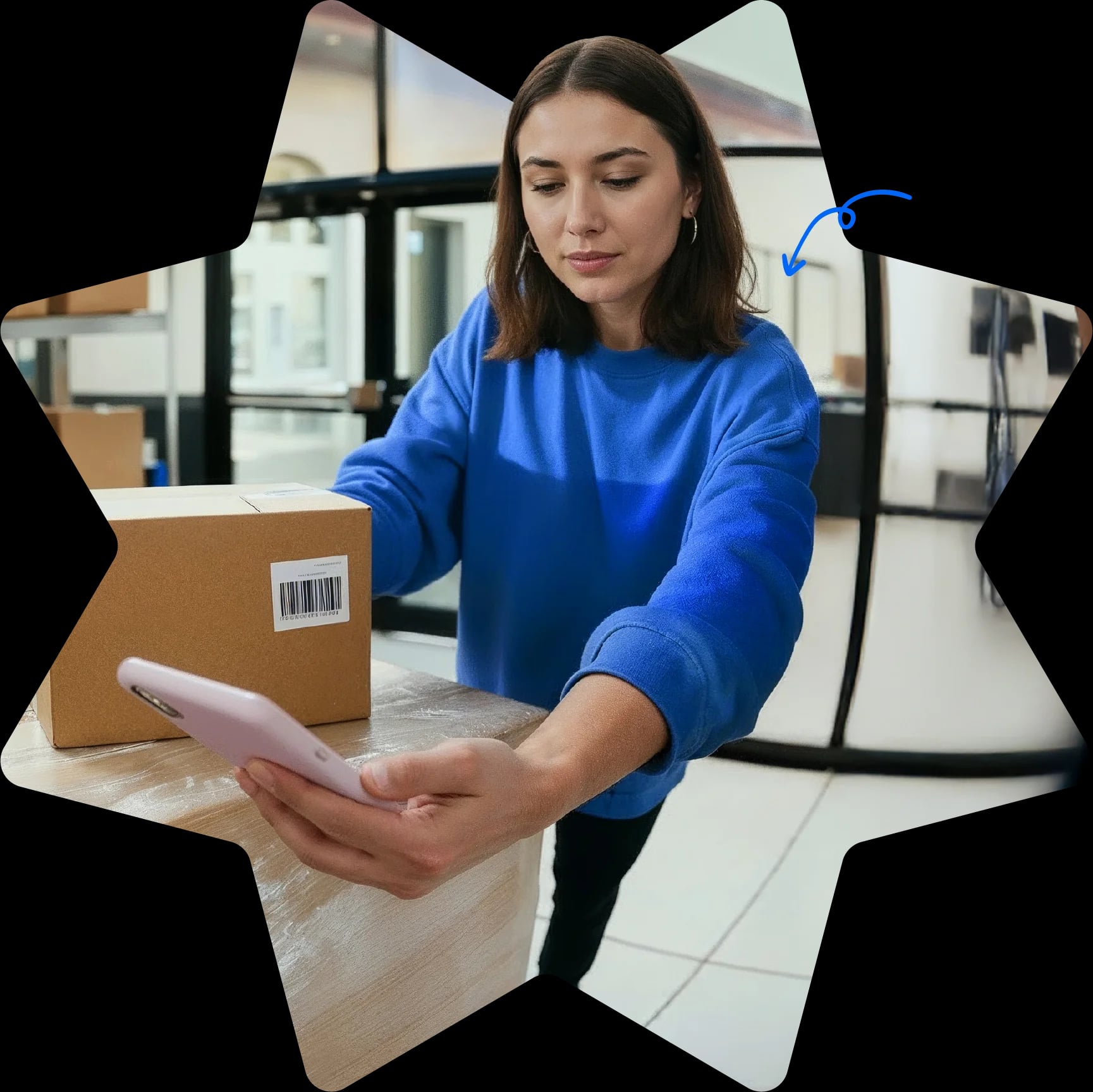Star-shaped Starshipit homepage hero image showing a warehouse team member packing an order while checking shipping details on a mobile phone