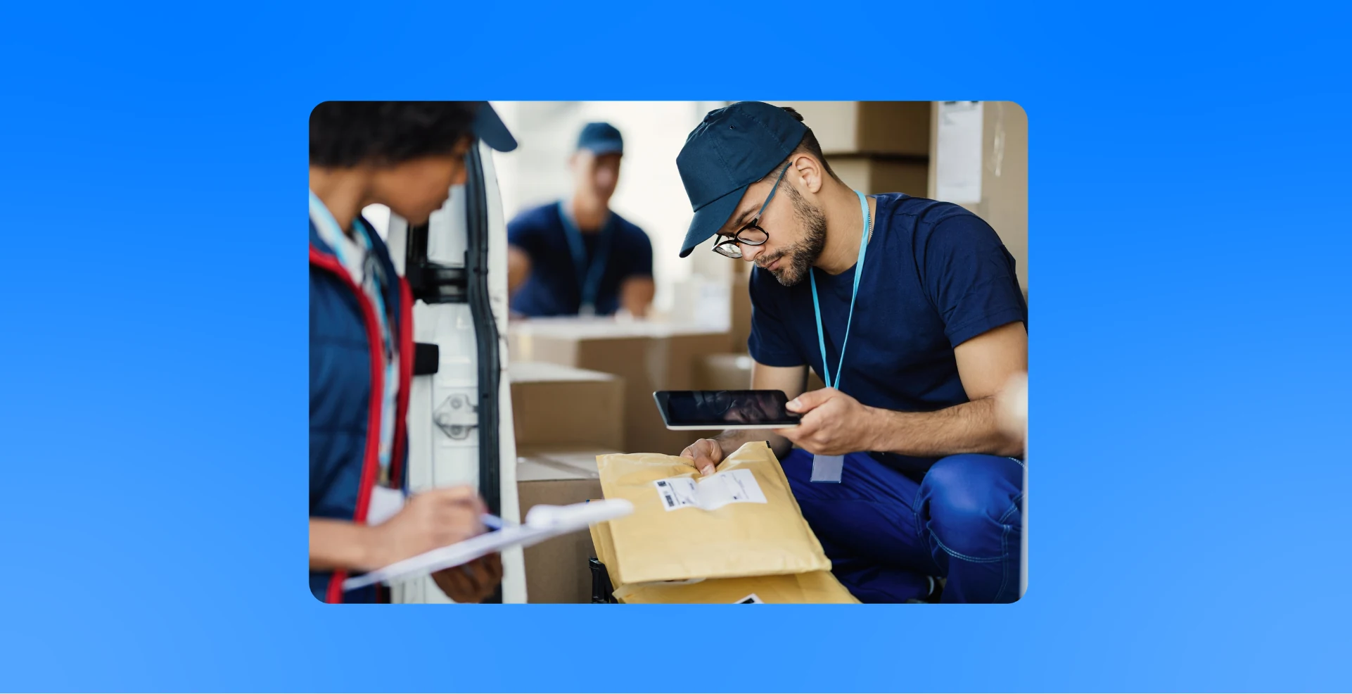 Shipping worker checking a parcel label on a tablet beside a delivery van Shipping worker checking a parcel label on a tablet beside a delivery van