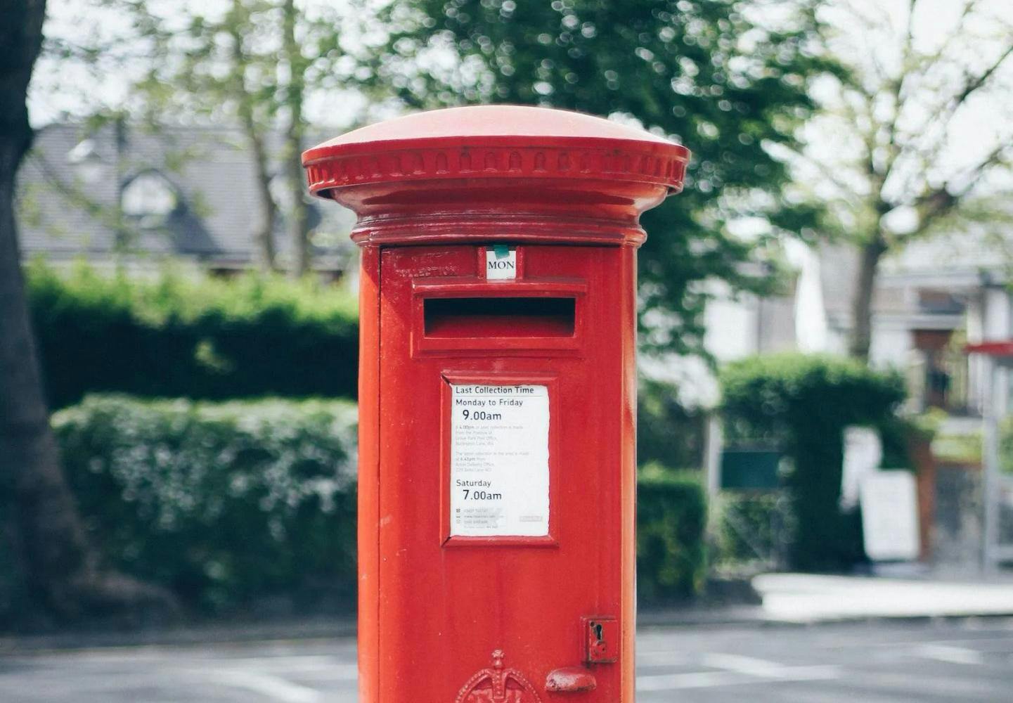Red post box on street