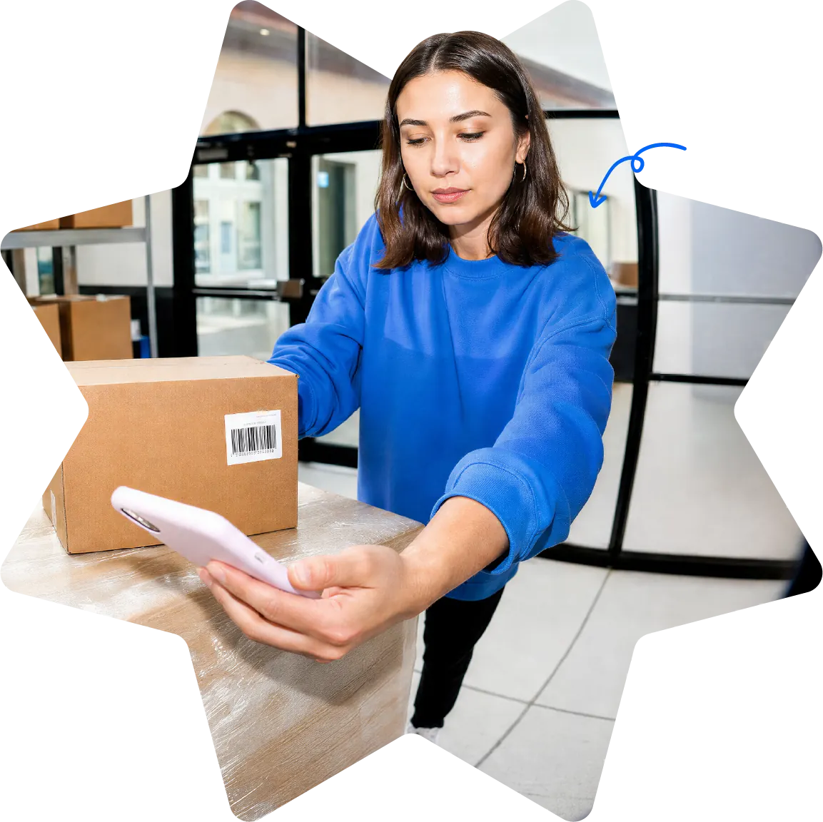 Star-shaped Starshipit homepage hero image showing a warehouse team member preparing a parcel while checking shipping details on a mobile phone Star-shaped Starshipit homepage hero image showing a warehouse team member preparing a parcel while checking shipping details on a mobile phone